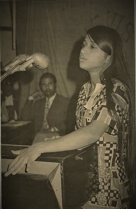 Teen Georgina Huq singing in a competition